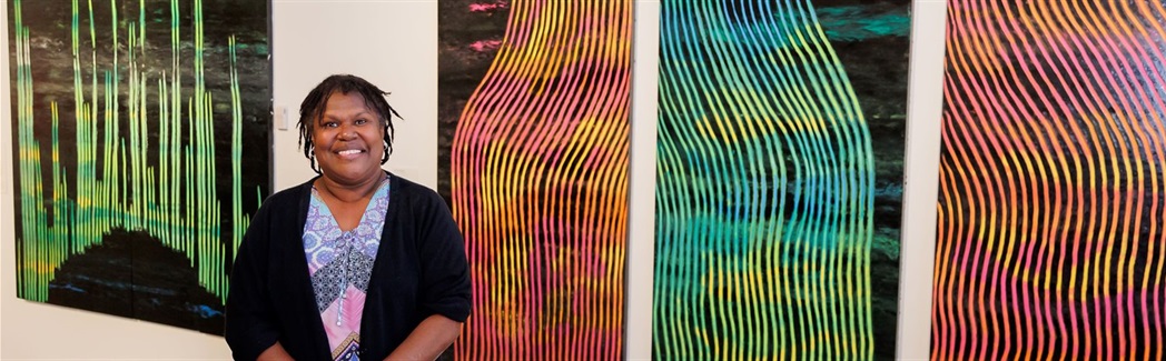 Rosella Namok with winning artworks 2024 Gold Awards_Footprints web banner.jpg